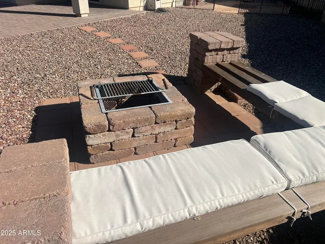 a bed sitting in a bedroom next to a lamp