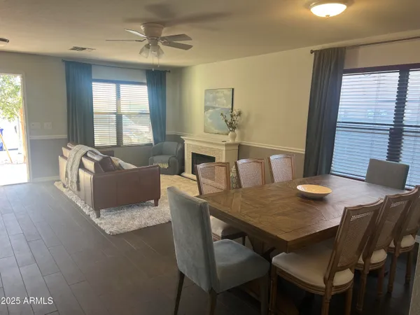 a view of a dining room with furniture window and outside view