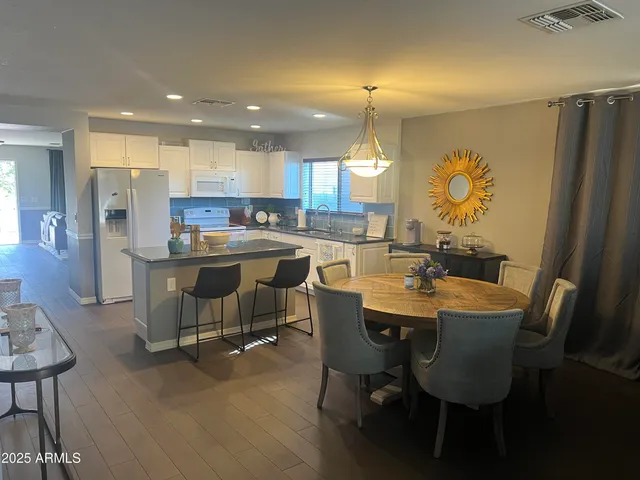 a view of a dining room with furniture