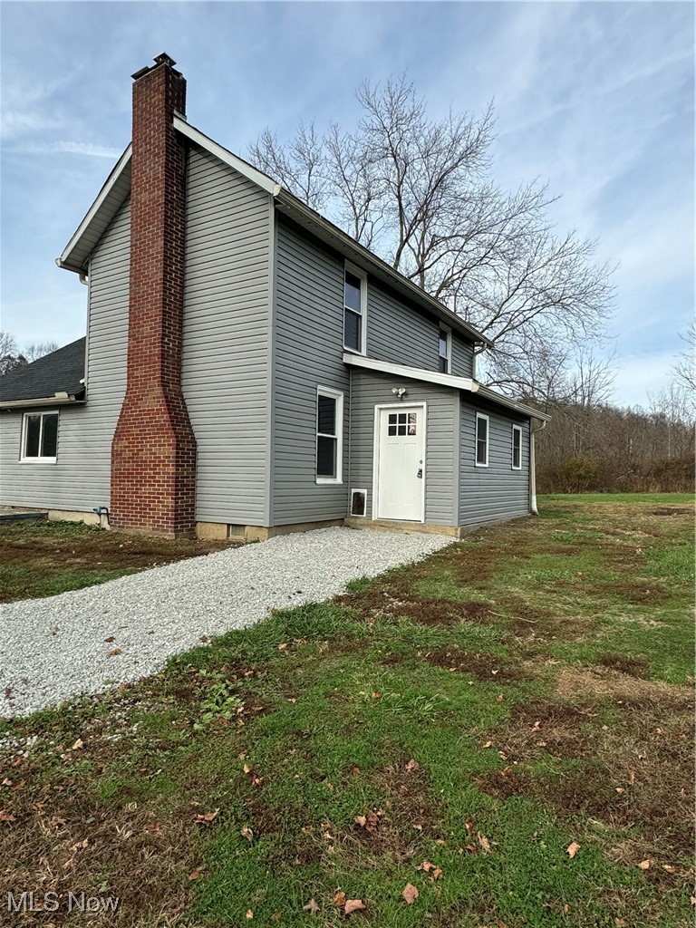 5155 Center Road Philo, OH 43771 - Photo 4 of 37 Back of house with a yard
