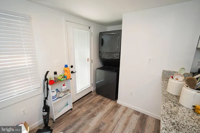 a storage room with wooden floor and furniture