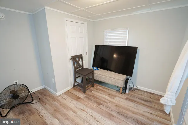 a bedroom with a bed and a chair