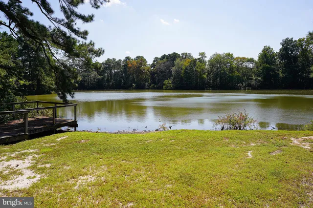 a view of a swimming pool with an outdoor space and seating area