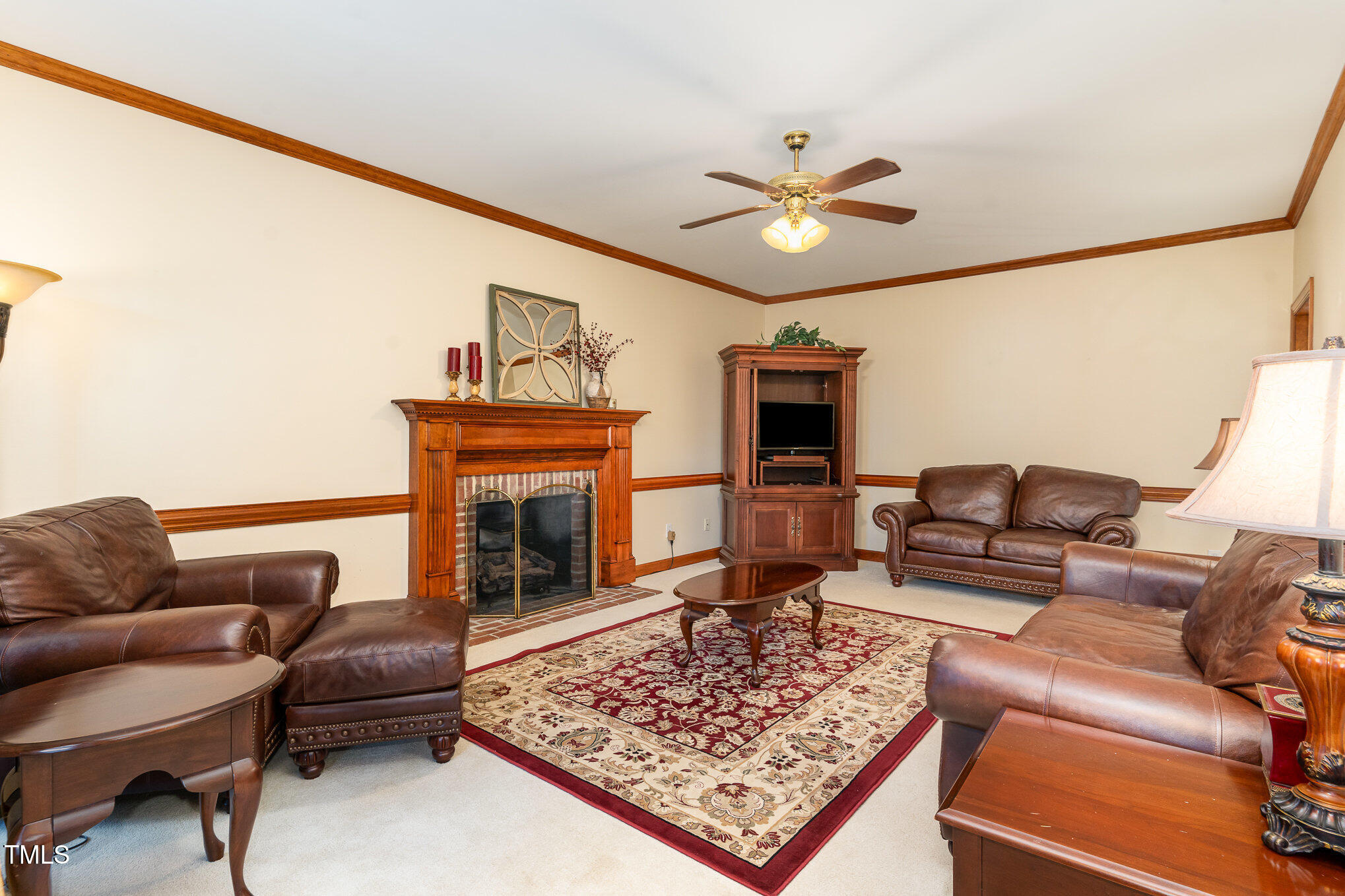 6132 Wolverhampton Drive Raleigh, NC 27603 - Photo 8 of 40 a living room with furniture and a fireplace