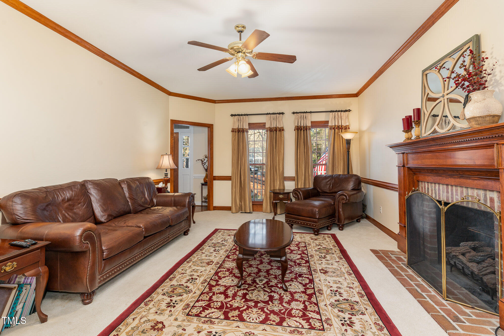 6132 Wolverhampton Drive Raleigh, NC 27603 - Photo 9 of 40 a living room with furniture and a fireplace