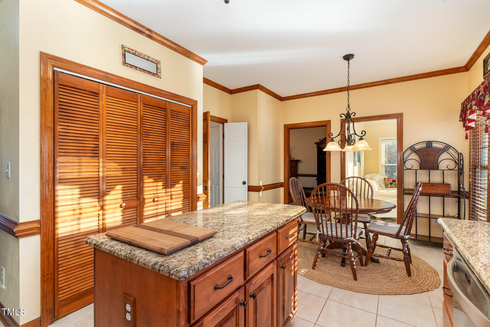 6132 Wolverhampton Drive Raleigh, NC 27603 - Photo 12 of 40 a kitchen with a stove a sink and cabinets