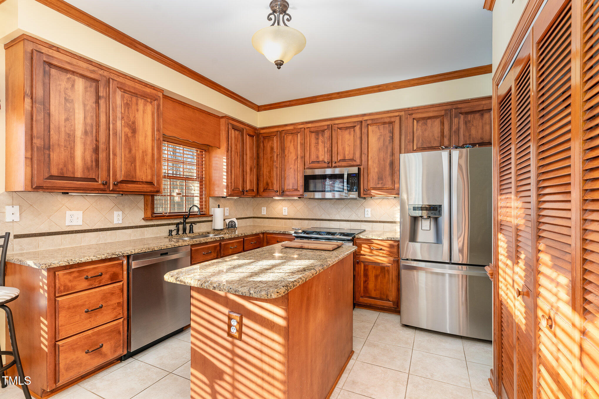 6132 Wolverhampton Drive Raleigh, NC 27603 - Photo 13 of 40 a kitchen with stainless steel appliances granite countertop a refrigerator stove and sink