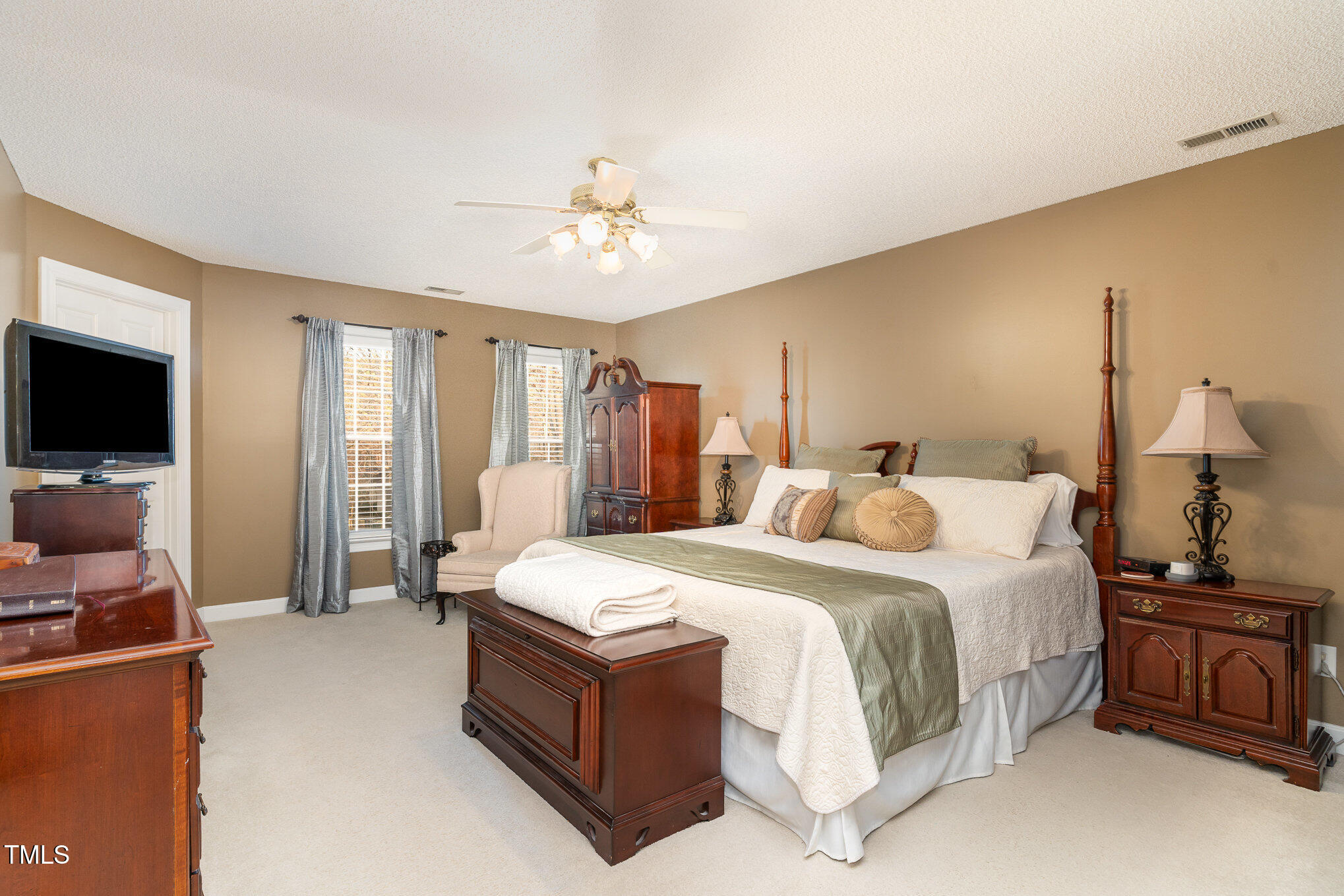 6132 Wolverhampton Drive Raleigh, NC 27603 - Photo 17 of 40 a bed room with a bed and a television