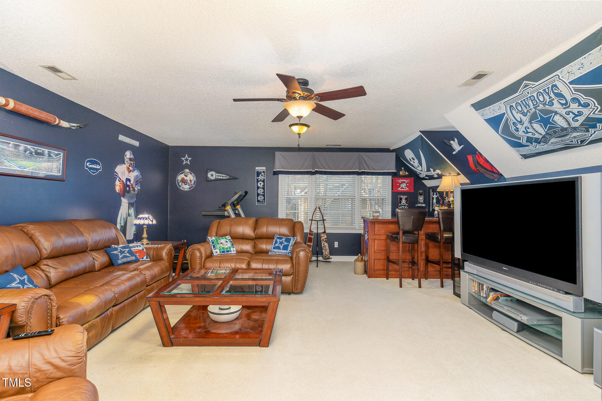 6132 Wolverhampton Drive Raleigh, NC 27603 - Photo 24 of 40 a living room with furniture and a flat screen tv