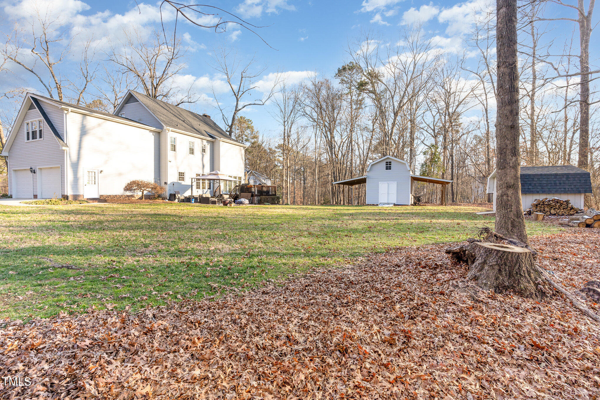 6132 Wolverhampton Drive Raleigh, NC 27603 - Photo 29 of 40 a backyard of a house with a yard and outdoor seating