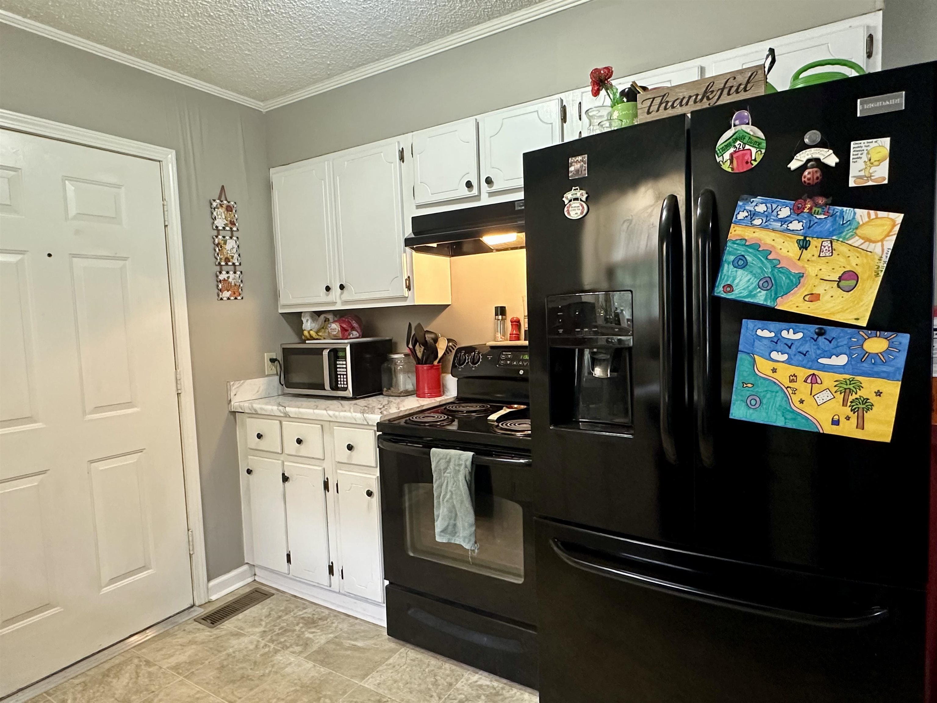 320 Clayton Road Finger, TN 38334 - Photo 6 of 16 a kitchen with stainless steel appliances granite countertop a refrigerator and a stove