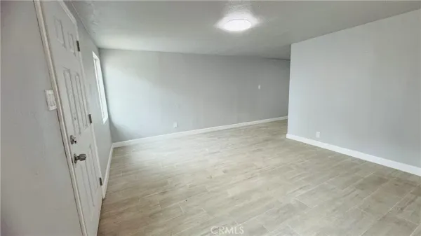 an empty room with a mirror