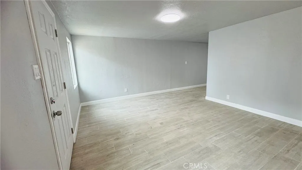 2523 Ogden Street Muscoy, CA 92407 - Photo 15 of 31 an empty room with a mirror