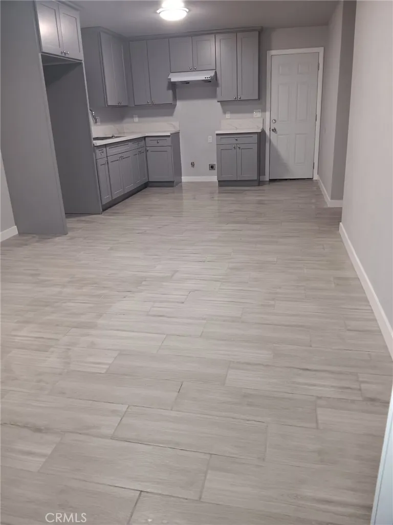 2523 Ogden Street Muscoy, CA 92407 - Photo 18 of 31 a view of a kitchen with white cabinets