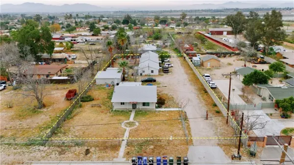 an aerial view of residential houses with outdoor space