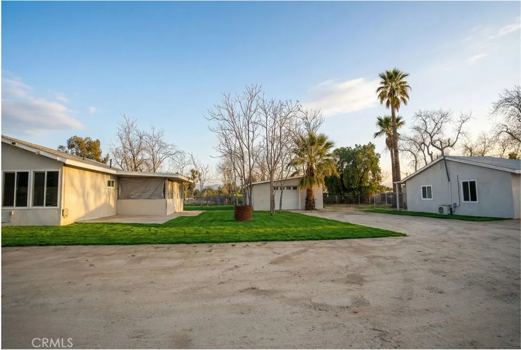 2523 Ogden Street Muscoy, CA 92407 - Photo 4 of 31 a view of a house with a yard and large tree
