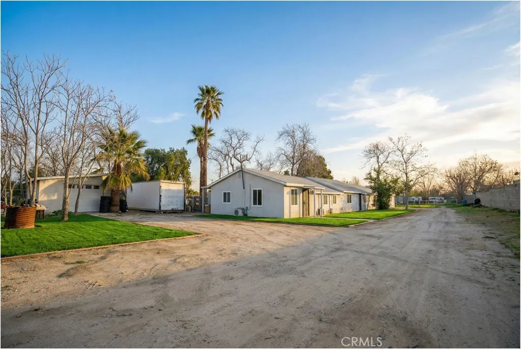 2523 Ogden Street Muscoy, CA 92407 - Photo 5 of 31 front view of a house with a big yard