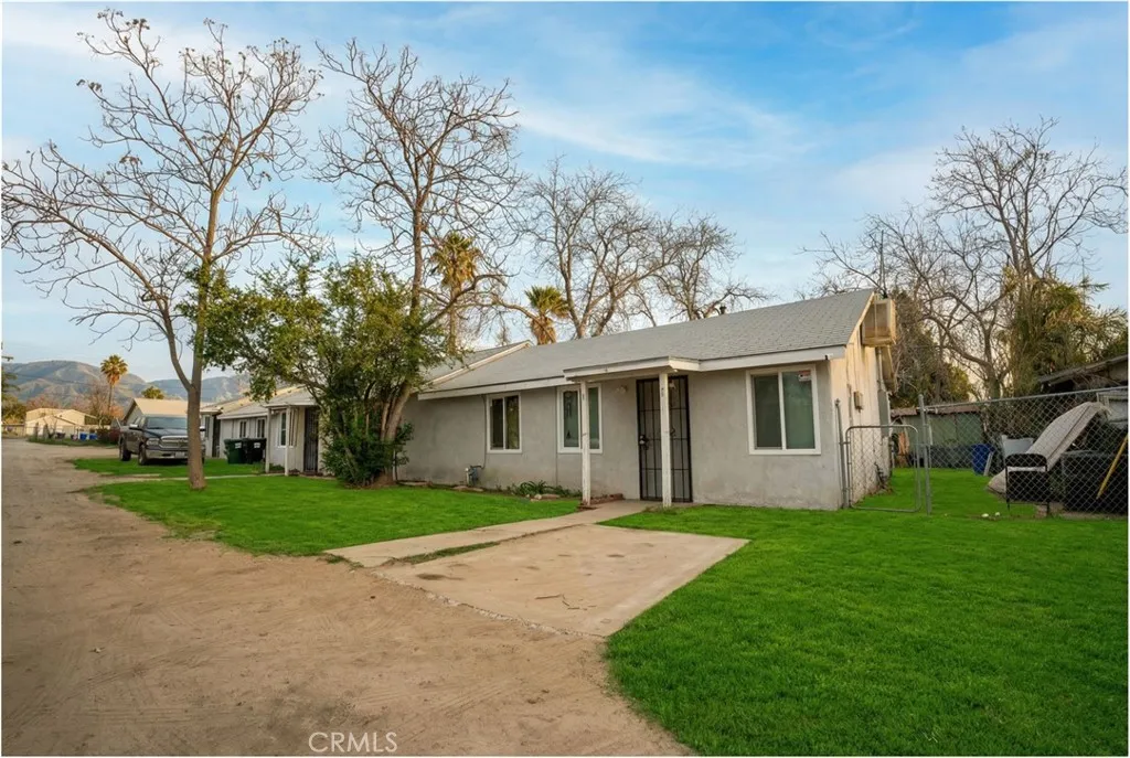 2523 Ogden Street Muscoy, CA 92407 - Photo 6 of 31 a front view of house with yard and green space