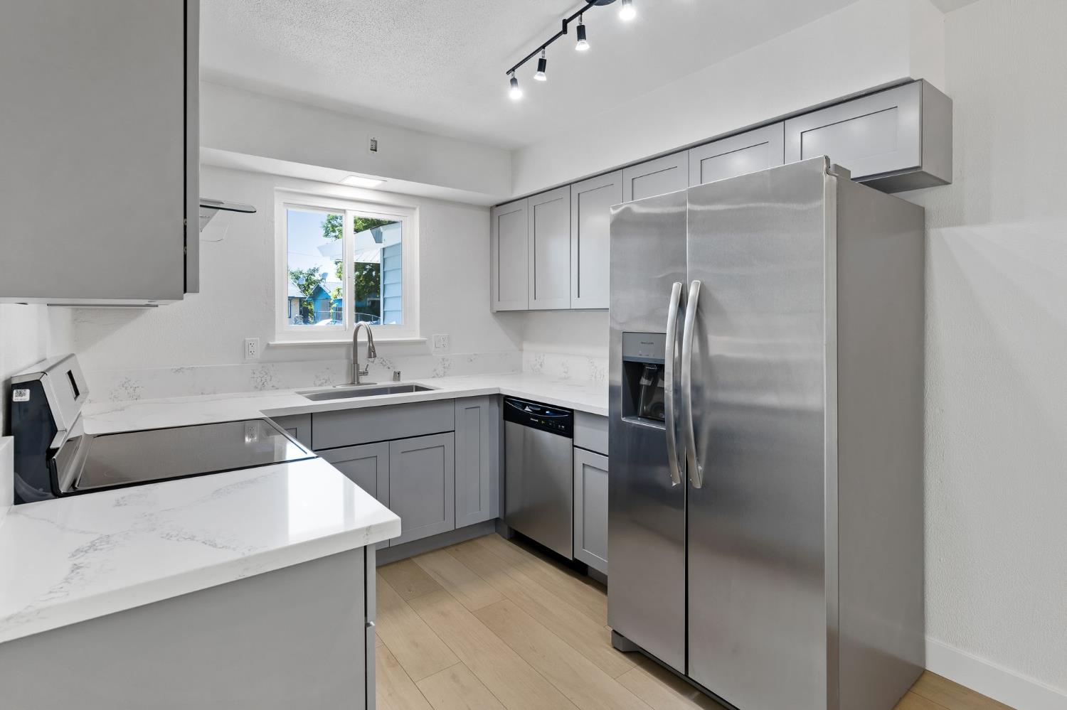 3270 Nareb Street Sacramento, CA 95838 - Photo 11 of 28 a kitchen with a refrigerator sink and cabinets