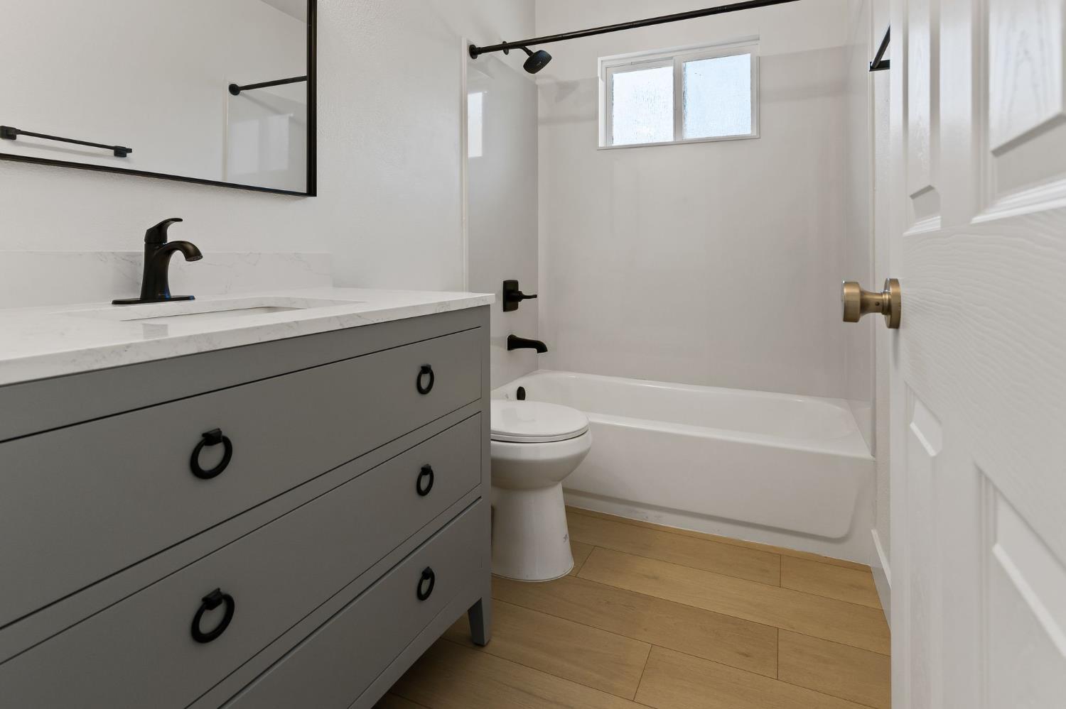 3270 Nareb Street Sacramento, CA 95838 - Photo 22 of 28 a bathroom with a bathtub a sink and mirror