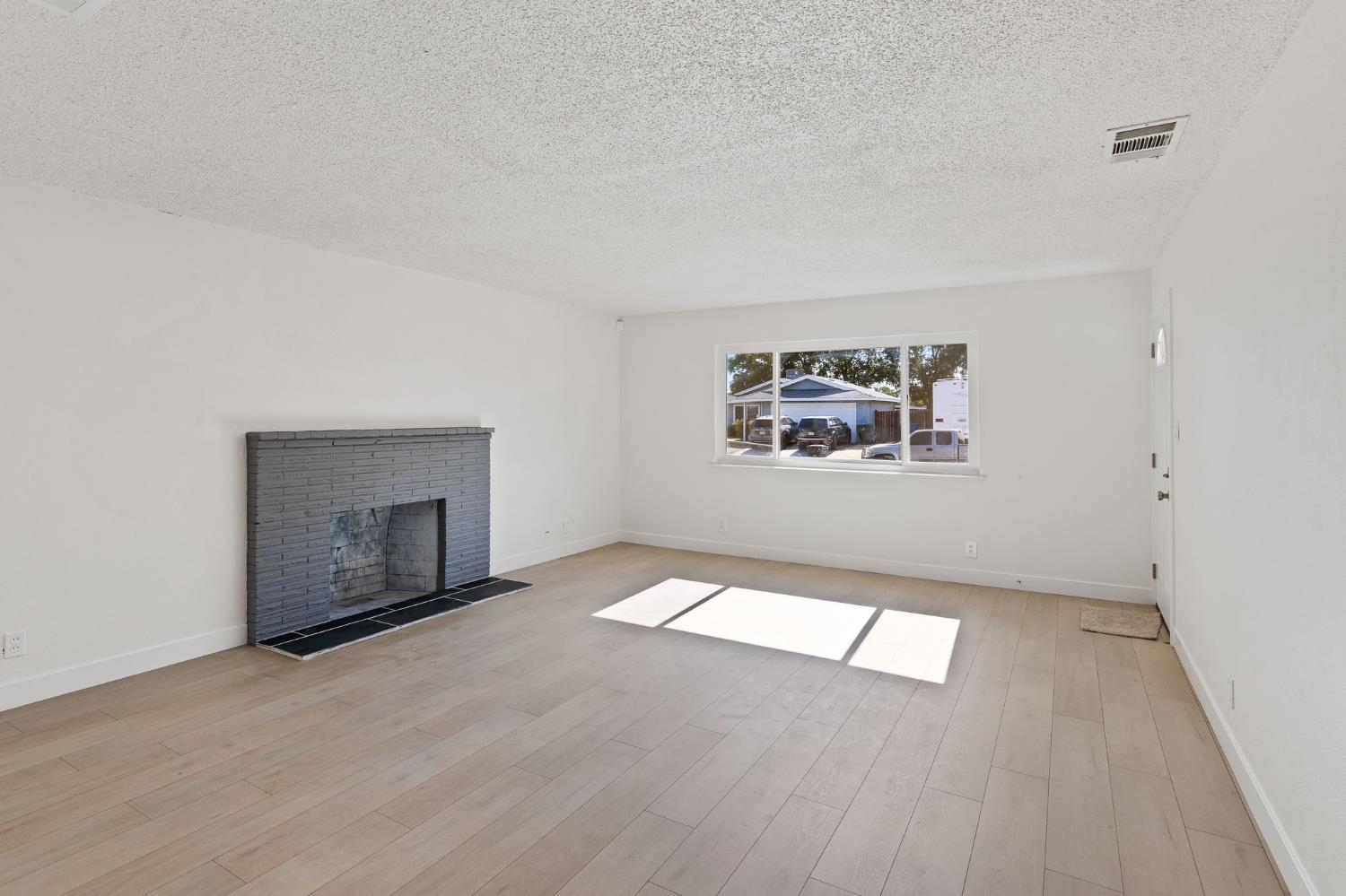 3270 Nareb Street Sacramento, CA 95838 - Photo 5 of 28 an empty room with windows and fireplace
