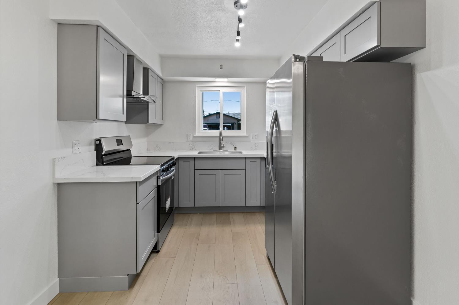 3270 Nareb Street Sacramento, CA 95838 - Photo 10 of 28 a kitchen with stainless steel appliances a sink stove and refrigerator