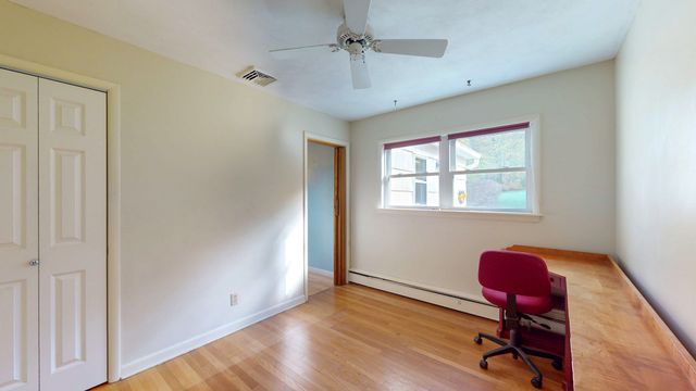 a workspace with furniture and wooden floor