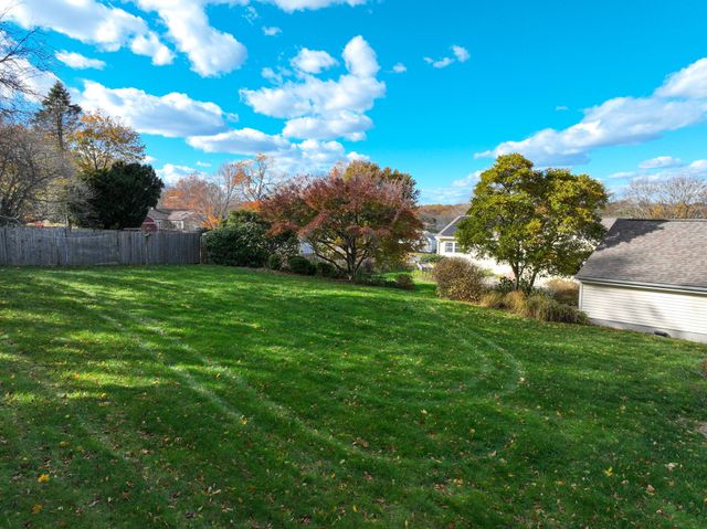 a backyard of a house with lots of green space
