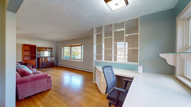 a living room with furniture and window