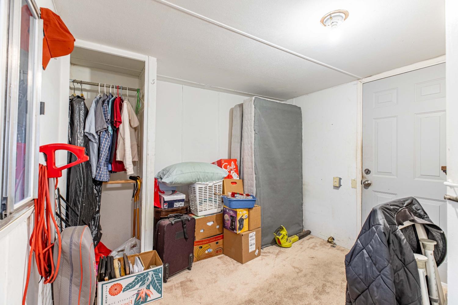 4449 South Carpenter Road, Unit D2 Modesto, CA 95358 - Photo 12 of 26 a view of a closet with storage