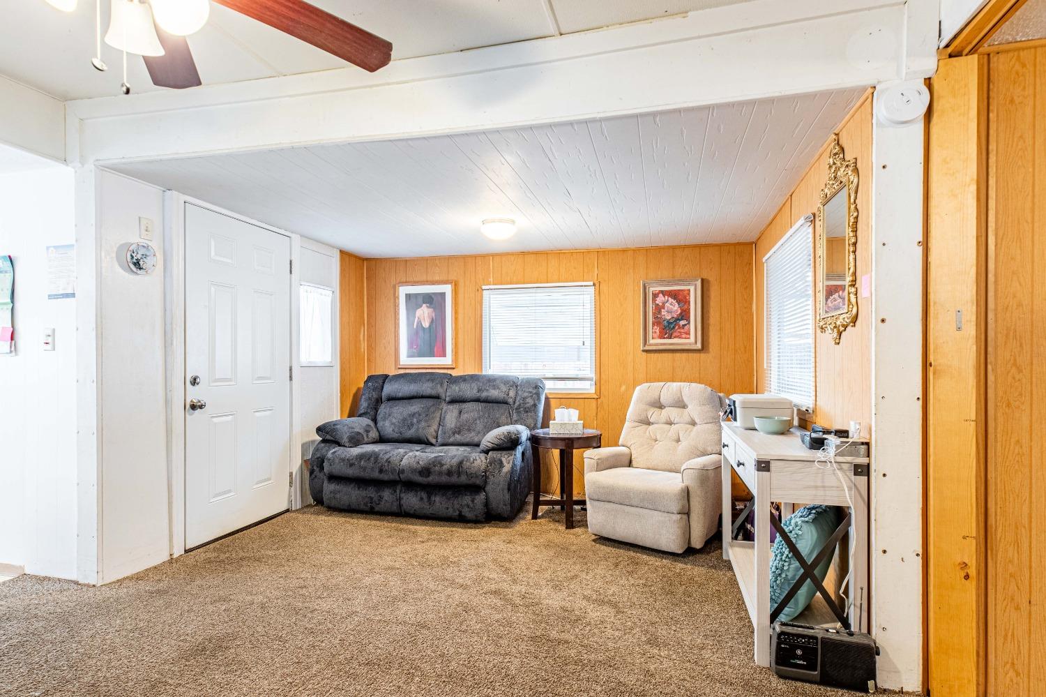 4449 South Carpenter Road, Unit D2 Modesto, CA 95358 - Photo 3 of 26 a living room with furniture and a large window