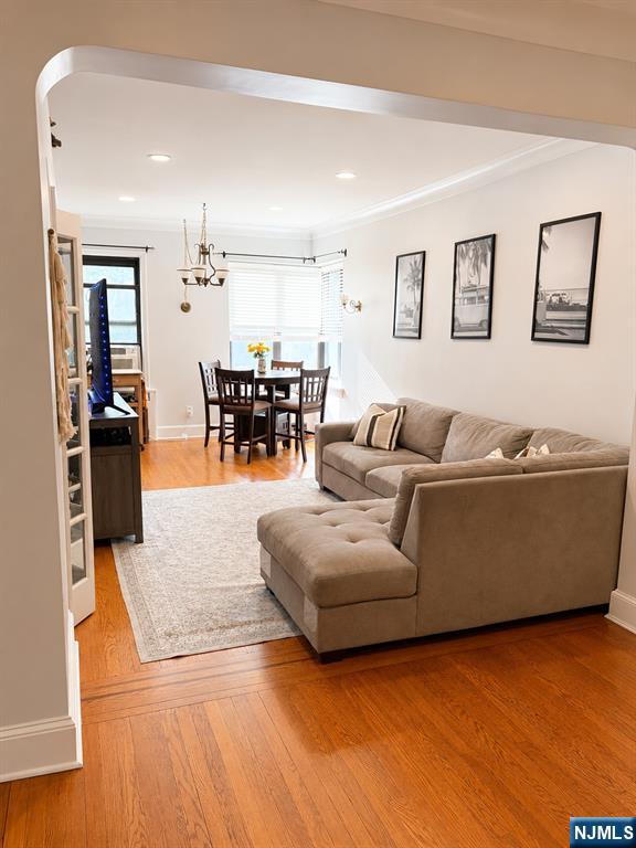 100 Prospect Avenue, Unit 5H Hackensack, NJ 07601 - Photo 7 of 17 a living room with furniture and wooden floor