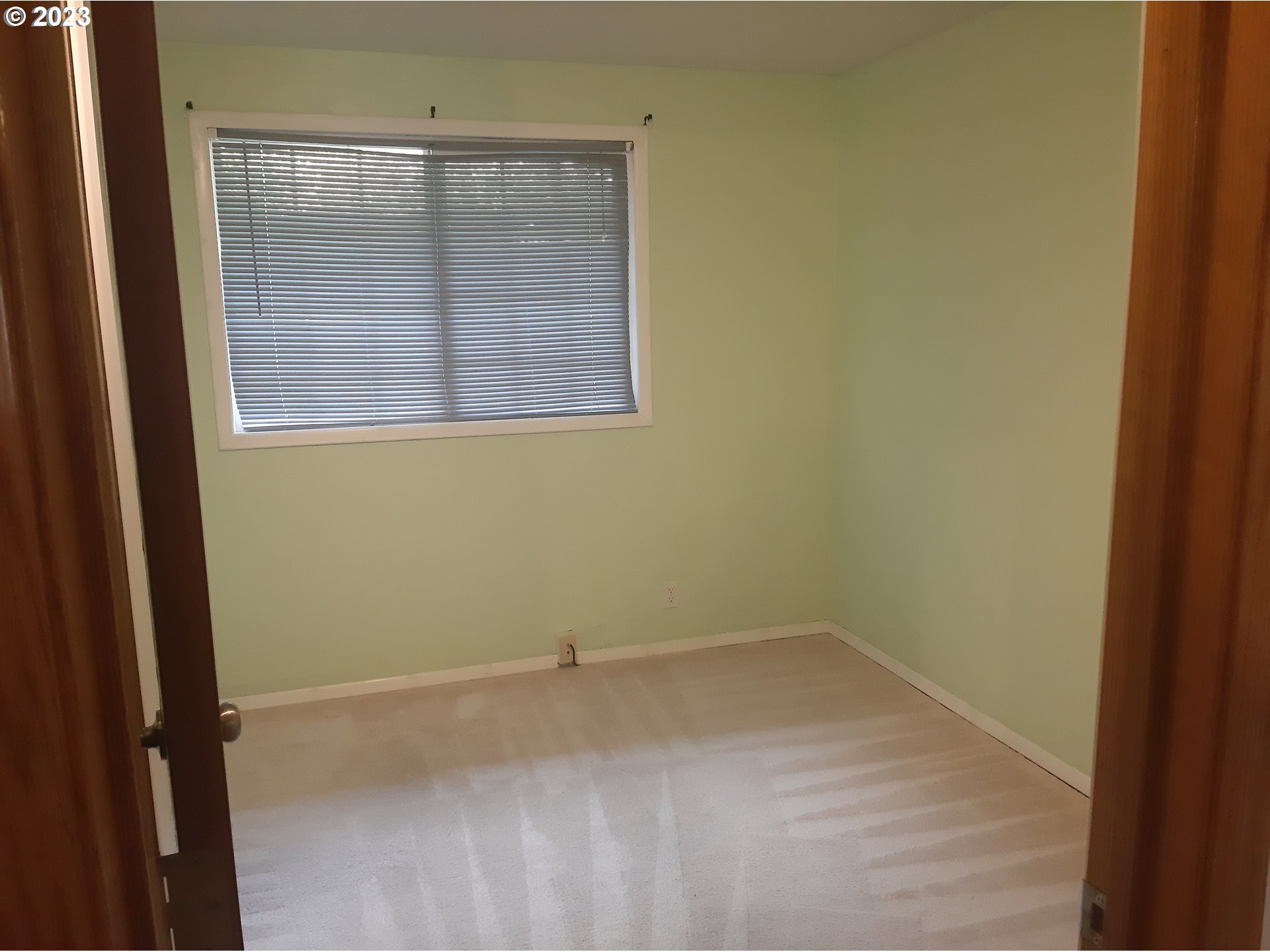 234 71st Street Springfield, OR 97478 - Photo 14 of 26 a view of a small space with wooden floor and a window