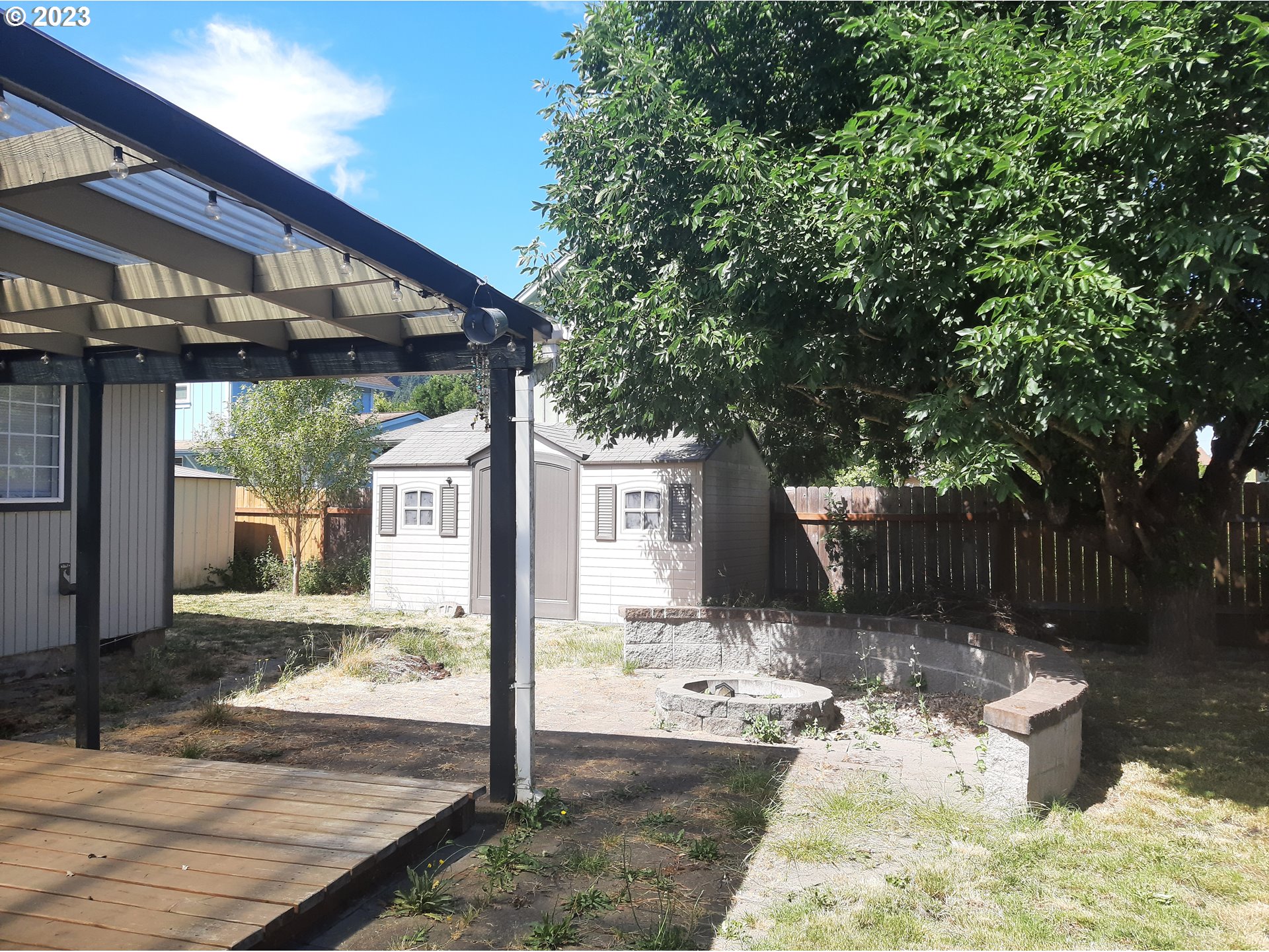 234 71st Street Springfield, OR 97478 - Photo 21 of 26 a front view of a house with a yard outdoor seating and yard