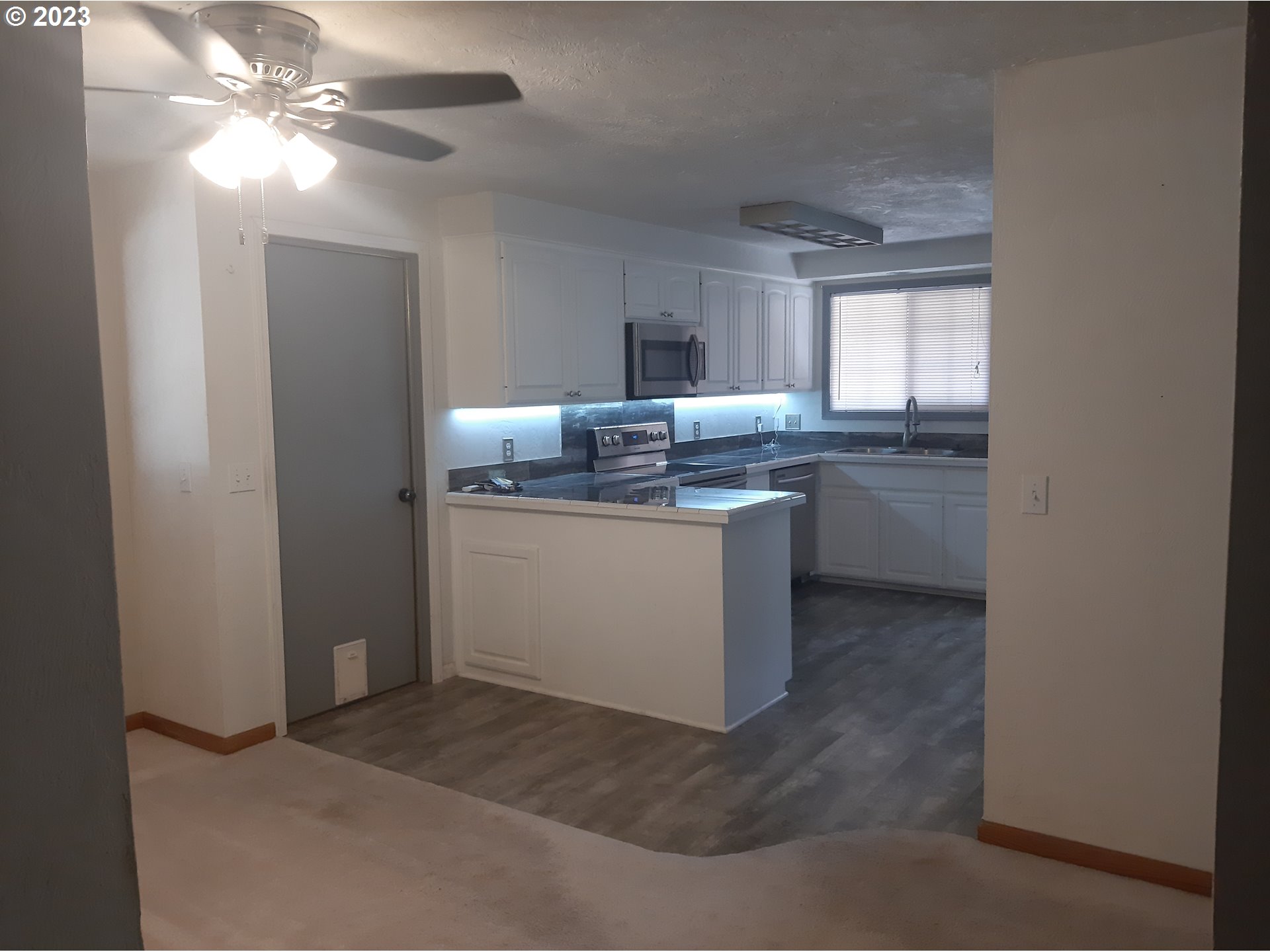 234 71st Street Springfield, OR 97478 - Photo 10 of 26 a kitchen with a sink cabinets and window