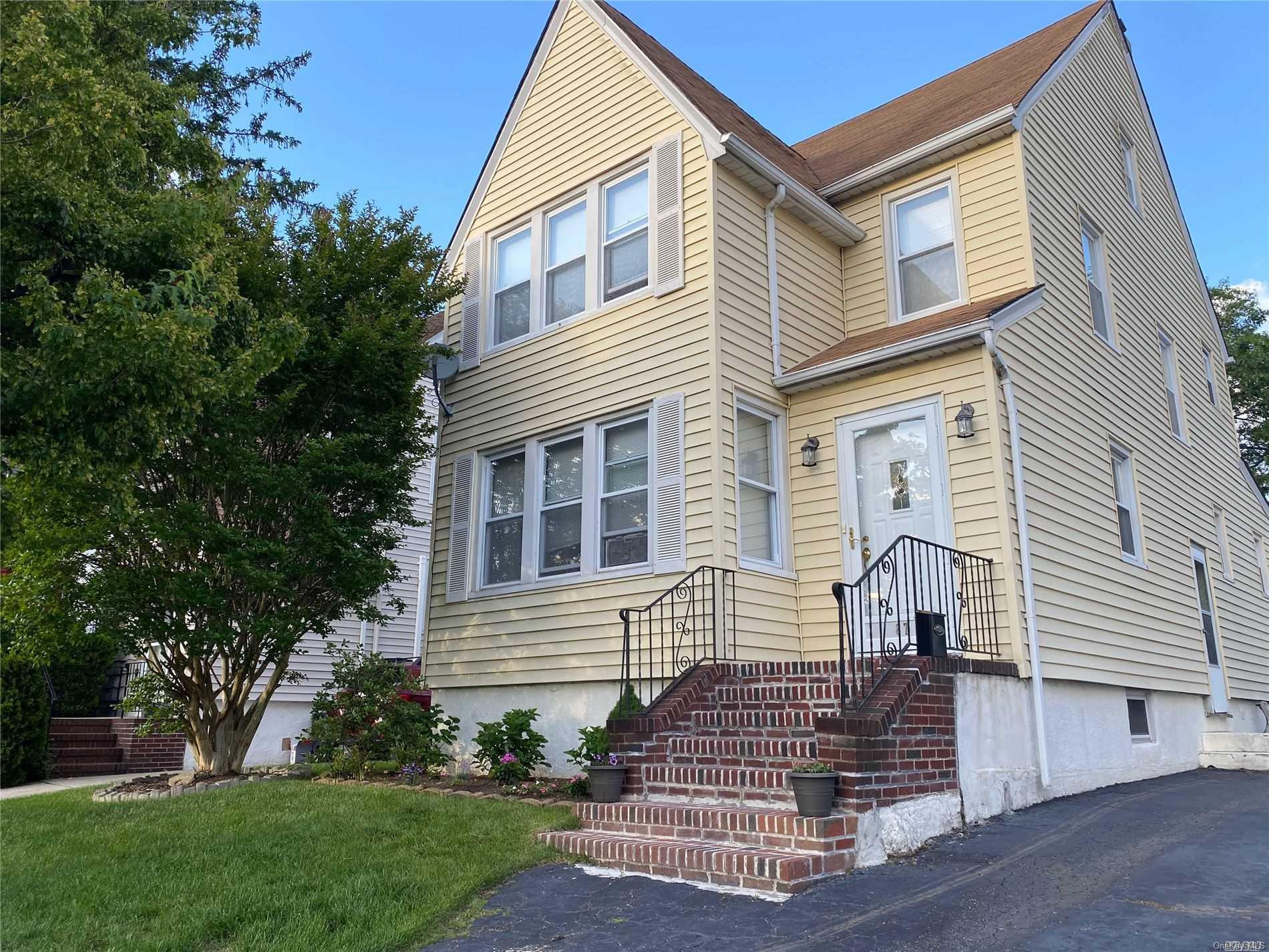 87 Amherst Road Valley Stream, NY 11581 - Photo 1 of 1 a view of a house with a yard