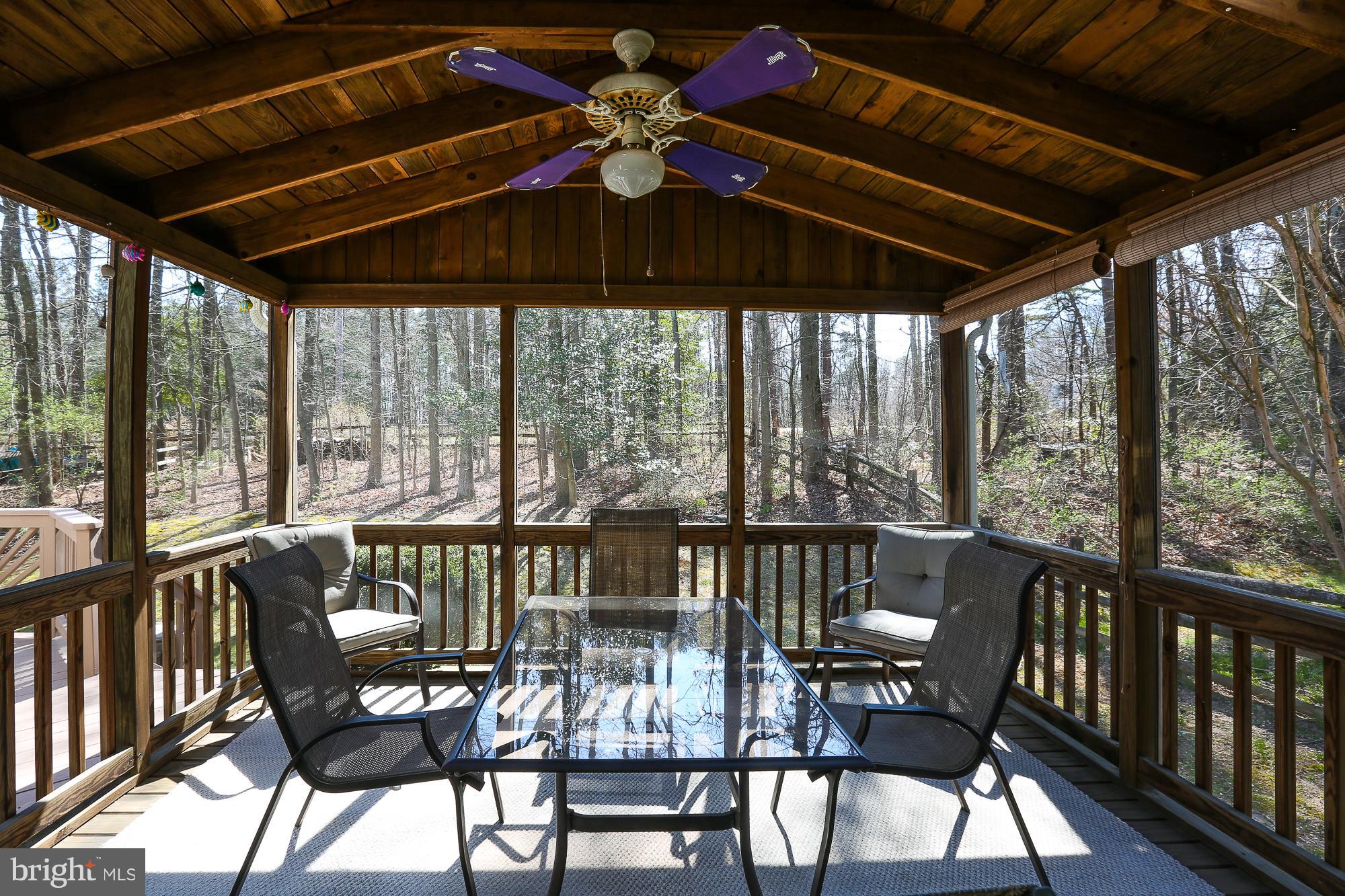 8609 Ashcroft Drive Laurel, MD 20708 - Photo 13 of 29 Screened in Porch with ceiling fan and light