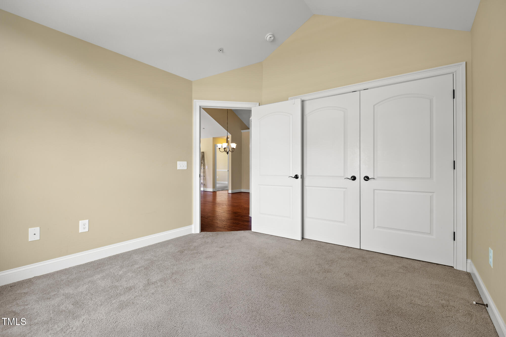 924 Carolina Bell Road Apex, NC 27502 - Photo 27 of 35 Guest bedroom with vaulted ceiling