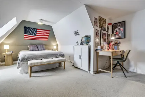 a bedroom with furniture and a bed