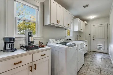 a view of a kitchen with electric appliances