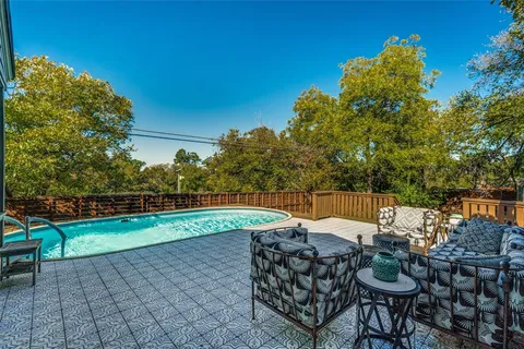 a view of an chairs and table in patio