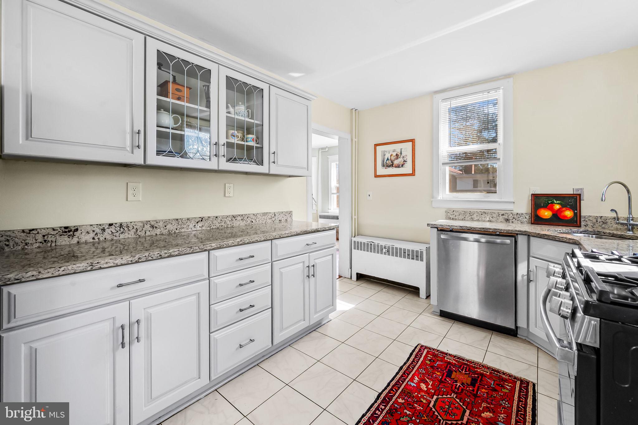 523 Orkney Road Baltimore, MD 21212 - Photo 16 of 40 a kitchen with stainless steel appliances granite countertop a sink and cabinets
