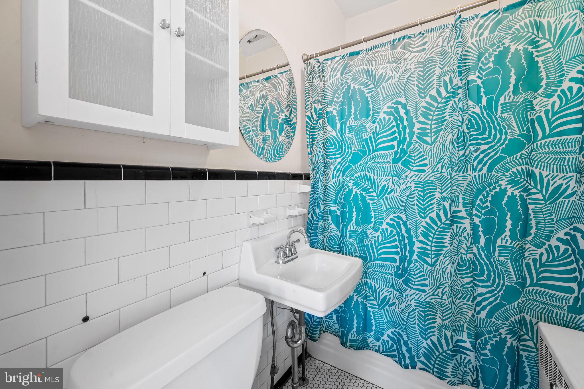 523 Orkney Road Baltimore, MD 21212 - Photo 18 of 40 a bathroom with a sink and mirror