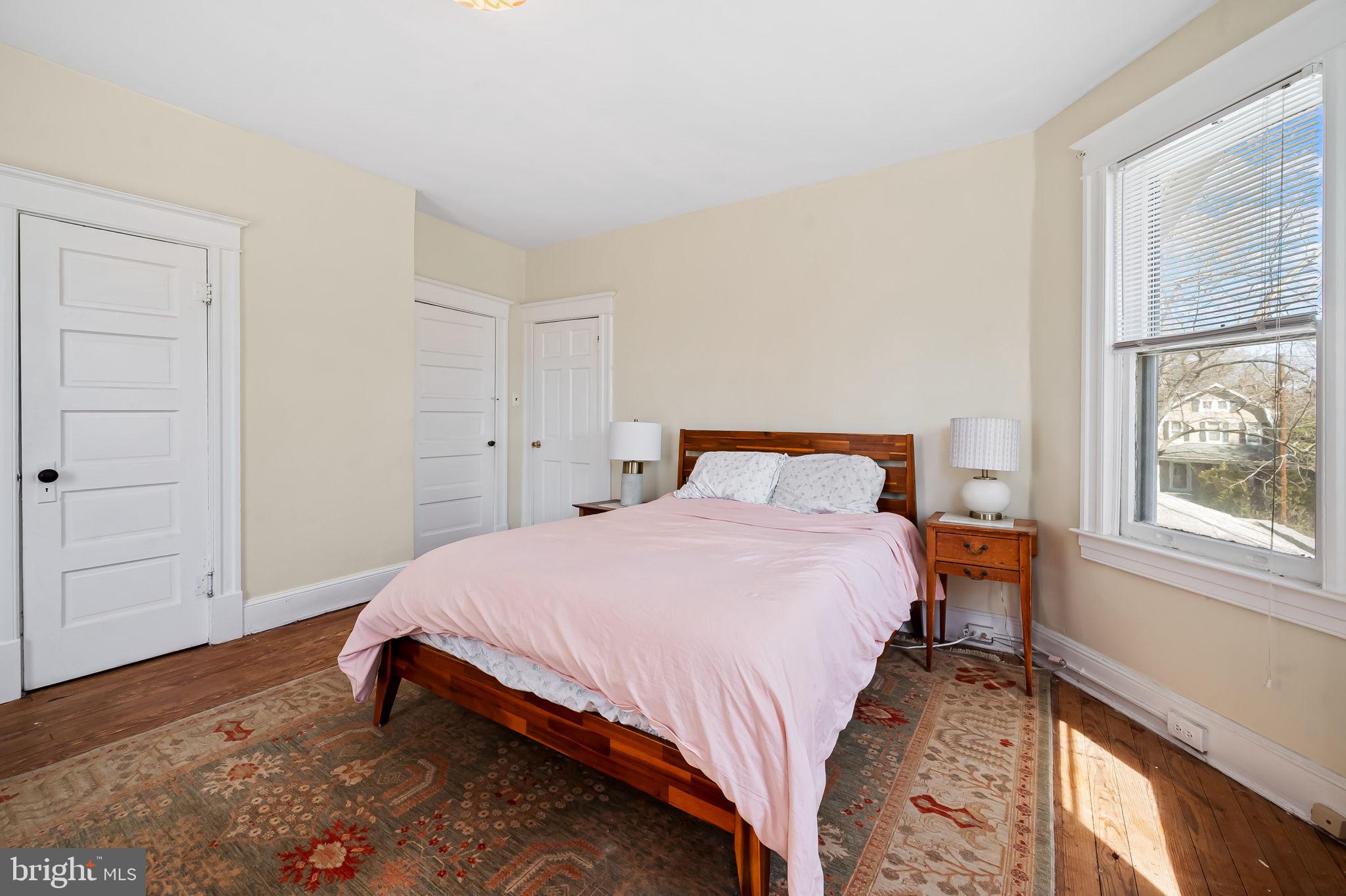 523 Orkney Road Baltimore, MD 21212 - Photo 25 of 40 a bedroom with a bed and wooden floor
