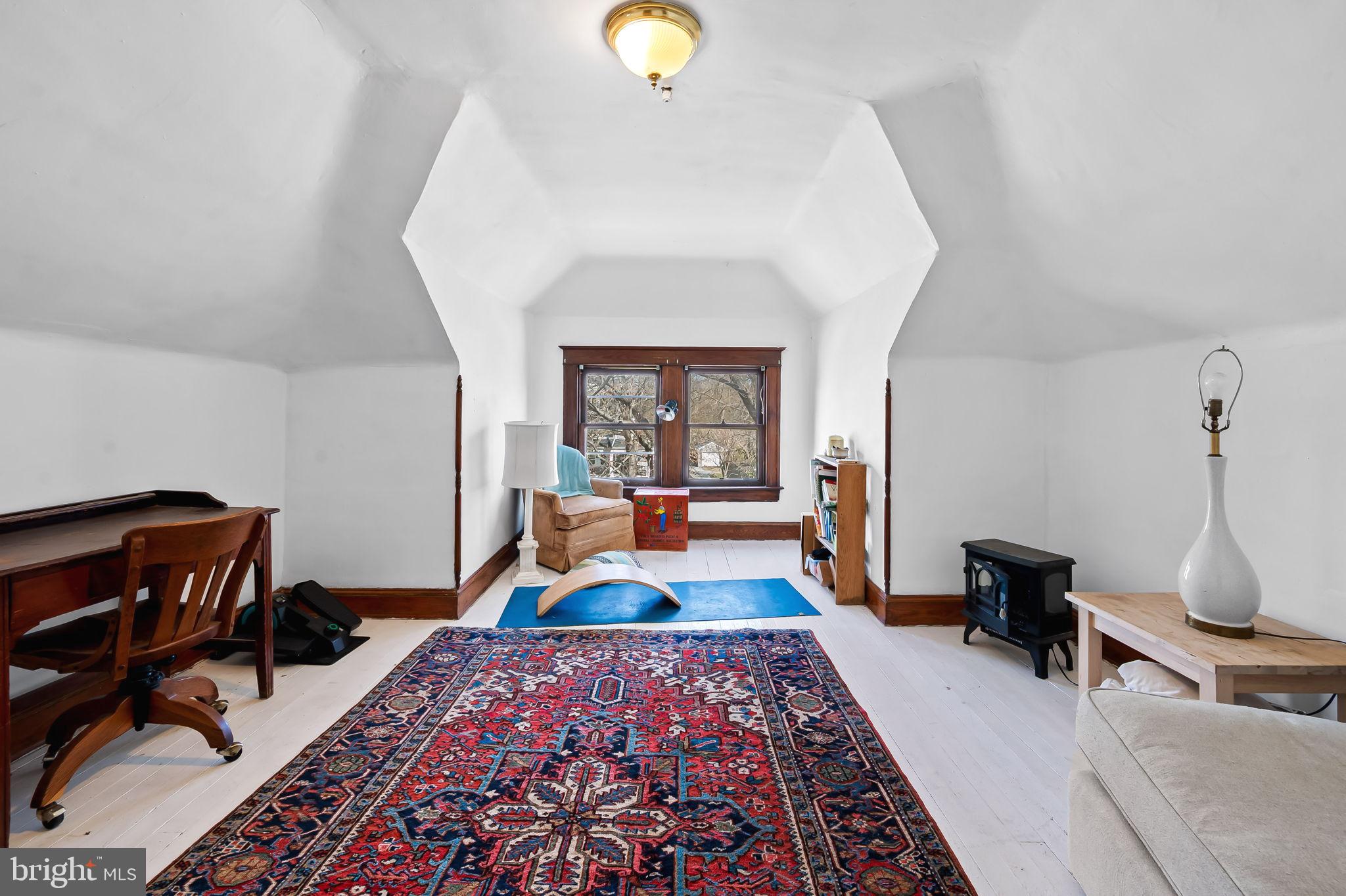 523 Orkney Road Baltimore, MD 21212 - Photo 30 of 40 a bedroom with a bed and a chandelier