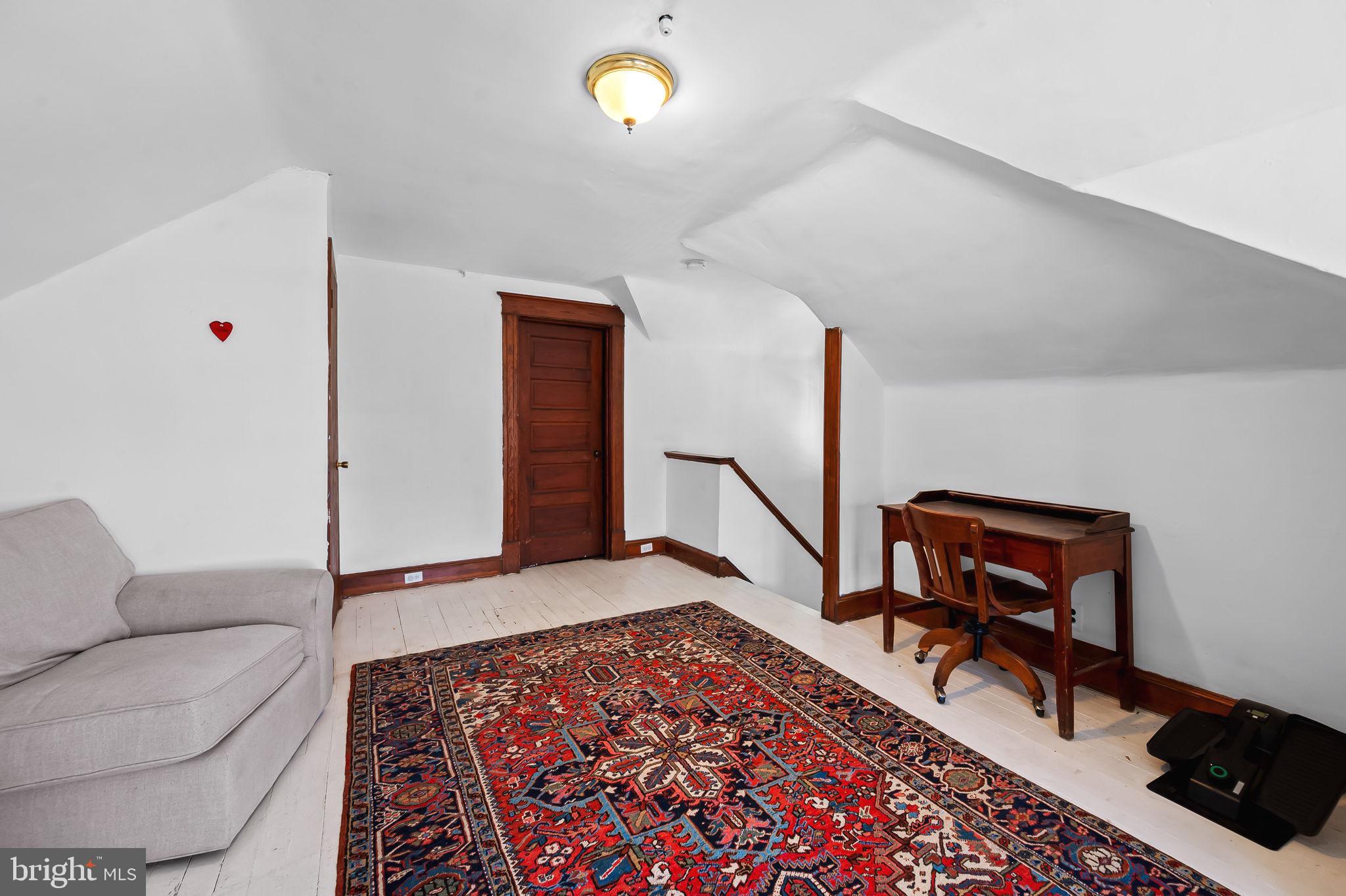 523 Orkney Road Baltimore, MD 21212 - Photo 32 of 40 a living room with furniture and a rug