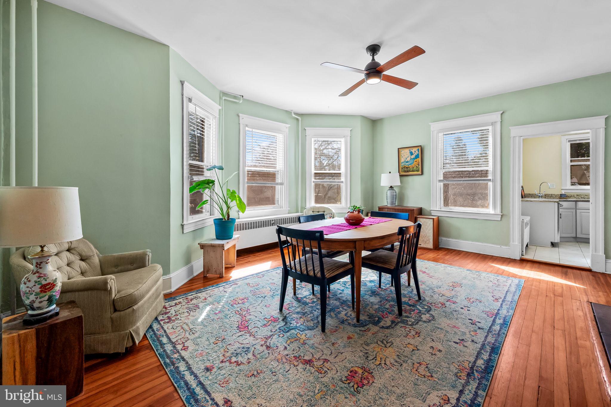 523 Orkney Road Baltimore, MD 21212 - Photo 10 of 40 a dining room with furniture a rug and wooden floor