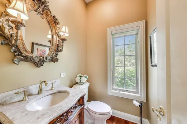 a spacious bathroom with a granite countertop sink a mirror and a shower