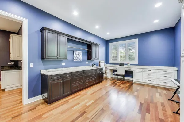 a bedroom with a bed and ceiling fan