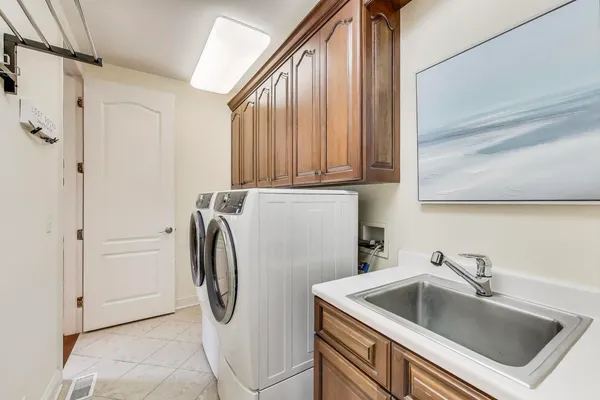 a bathroom with a sink and a large mirror